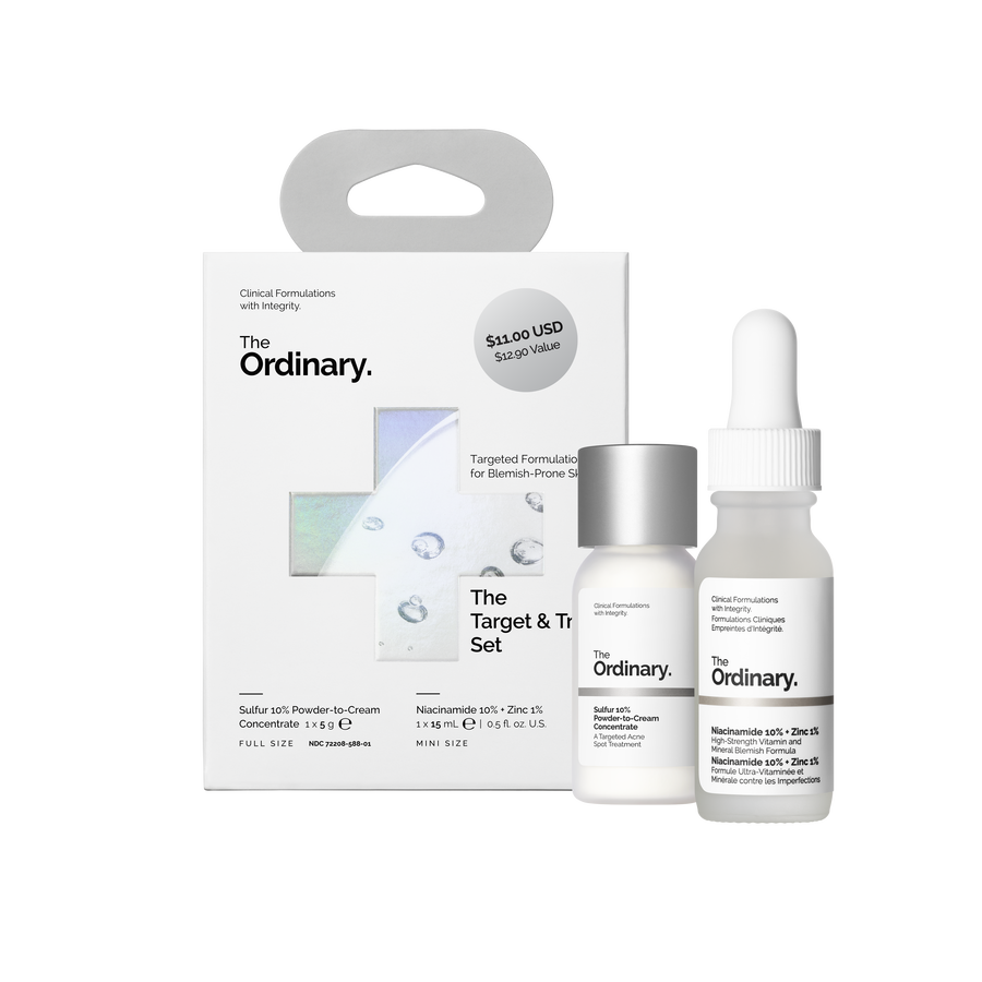 Target & Treat Set packaging box next to a full-size Sulfur 10% Powder-to-Cream Concentrate and a mini Niacinamide 10% + Zinc 1% serum.